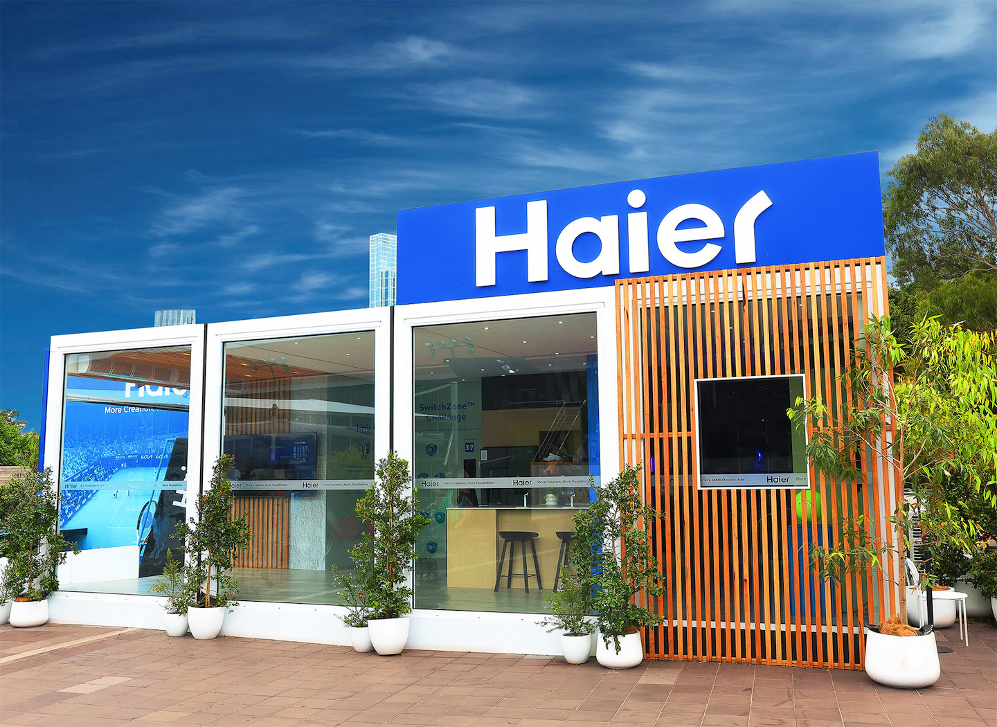 Exterior perspective of Haier's modular event structure at the Australian Open.