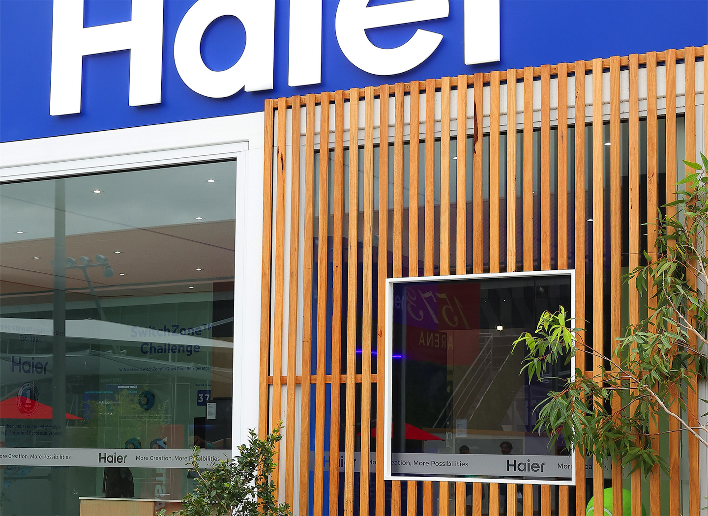 Showcase of Haier appliances within a modular display at the Australian Open.