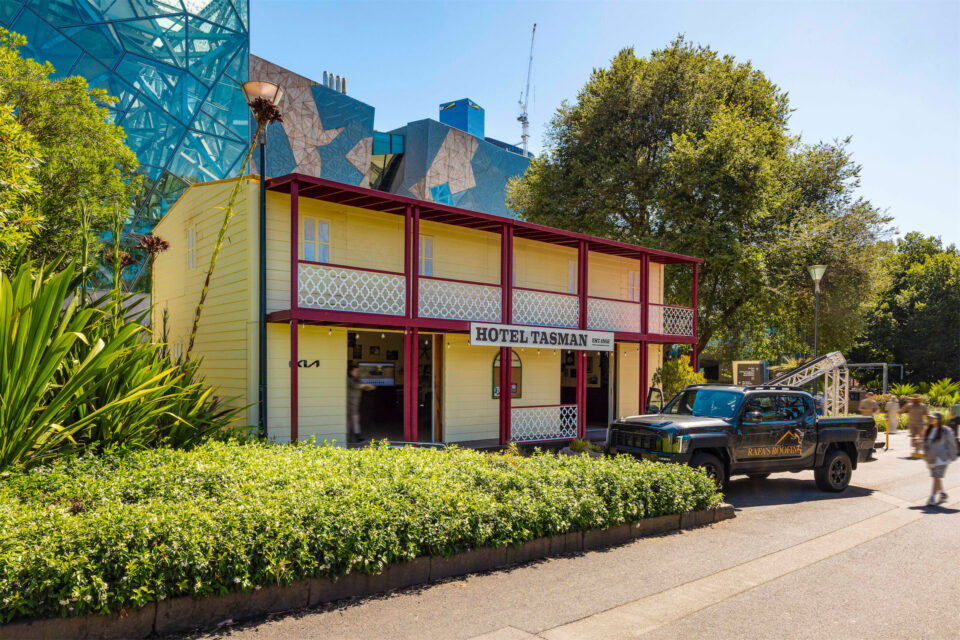 a KIA Tasman parked in front of an outback pub built of Groblox at the Australian Open 2026.