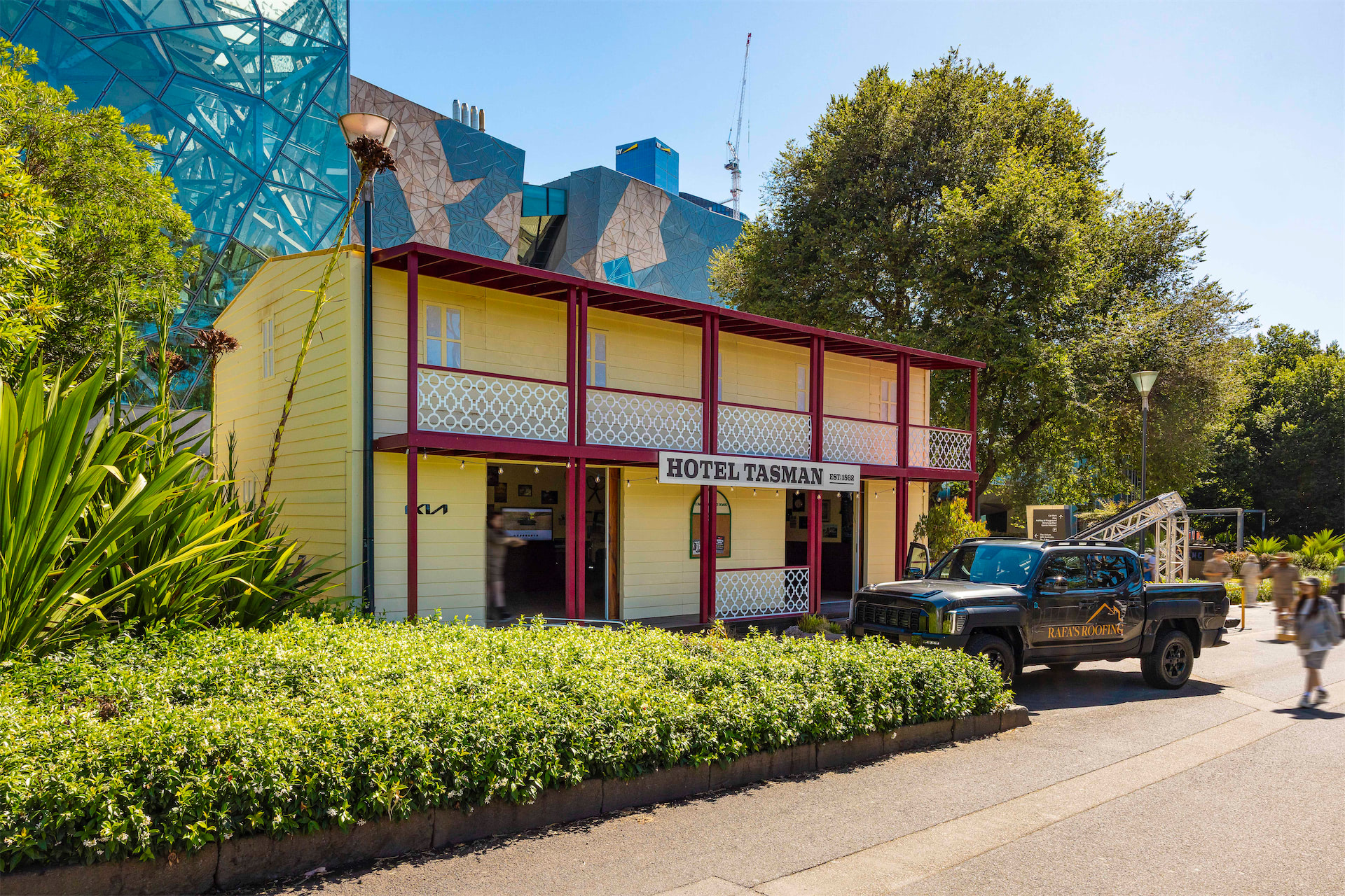 a KIA Tasman parked in front of an outback pub built of Groblox at the Australian Open 2026.