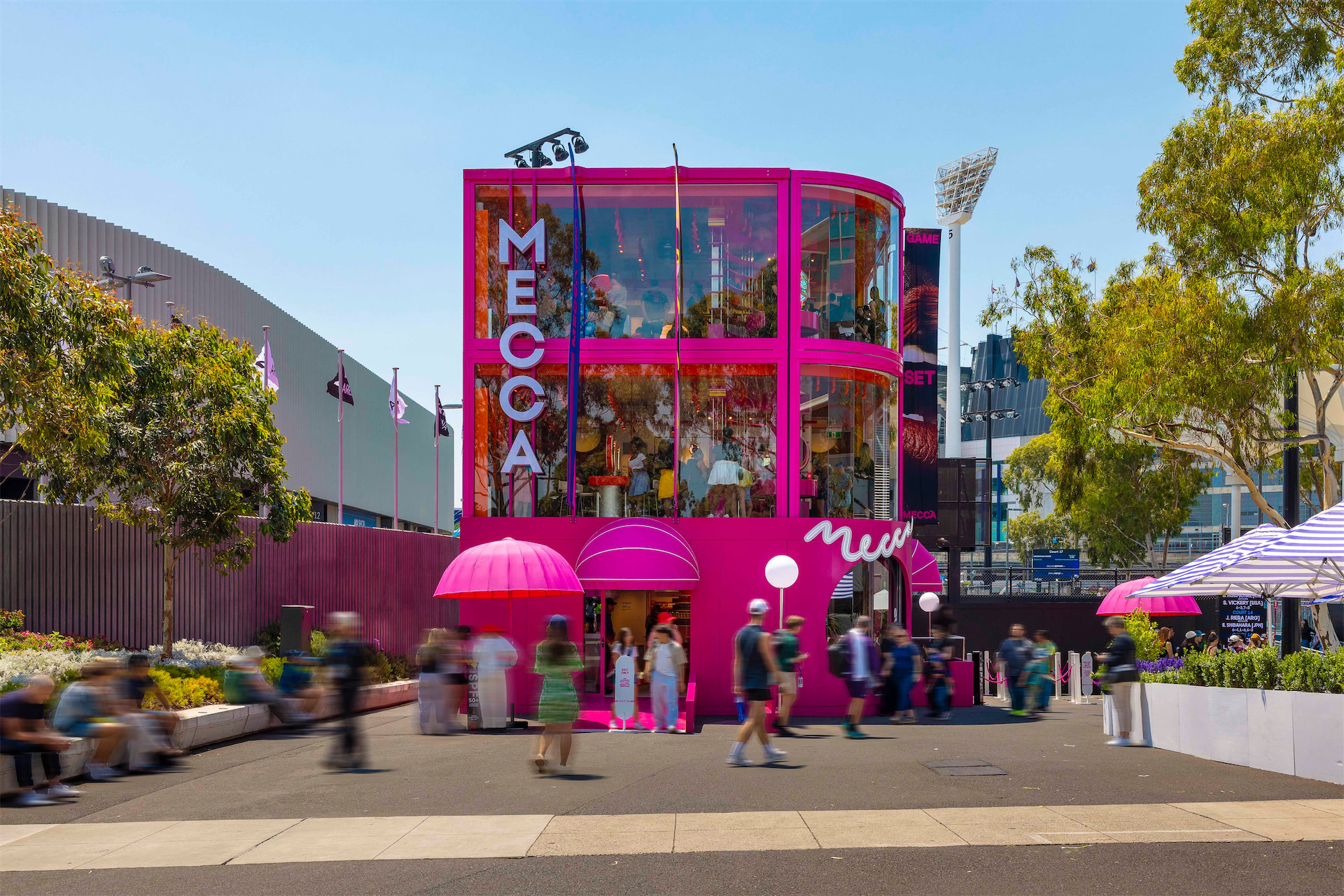 A Pink, MECCA branded, 3-level modular structure built with Groblox