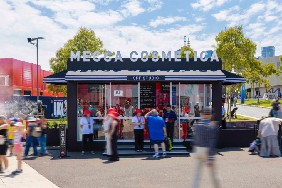 A group of people standing outside a pop-up store. Brand activation with groblox.