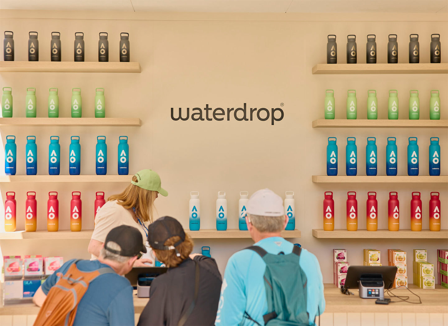 Visually appealing branding wall within Waterdrop's modular setup at the Australian Open.
